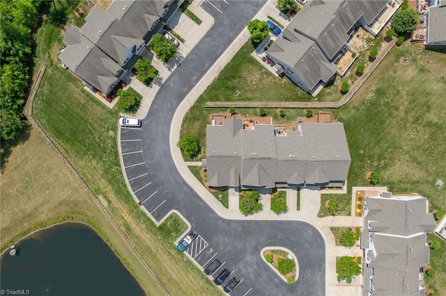 bird's eye view with a water view and a residential view