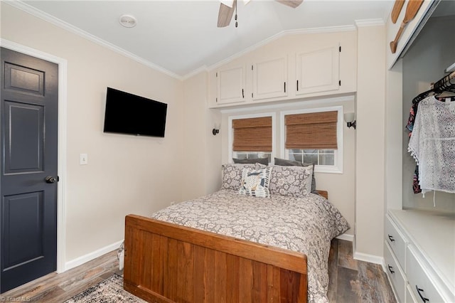 bedroom featuring baseboards, ornamental molding, dark wood-style floors, vaulted ceiling, and ceiling fan