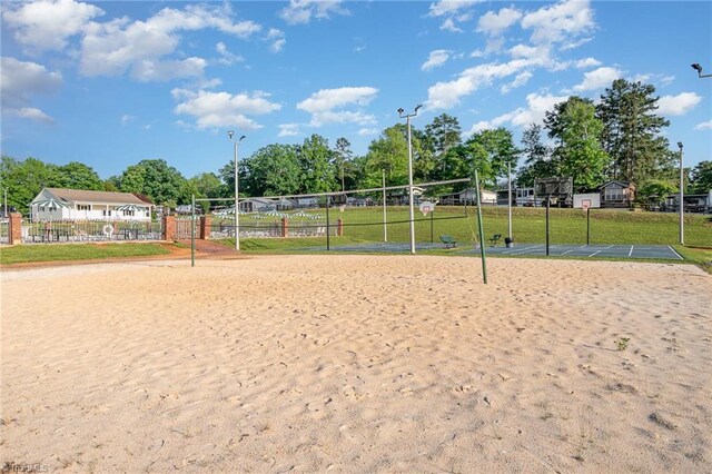 view of home's community featuring volleyball court and community basketball court