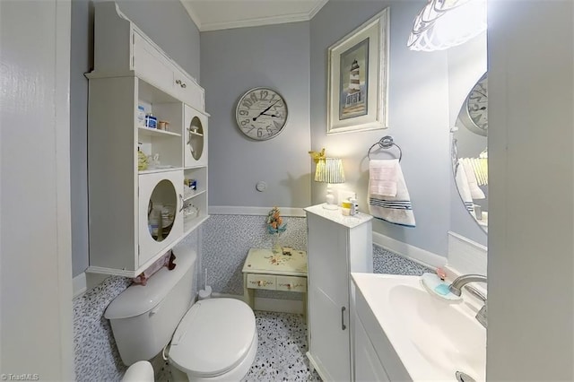 bathroom with toilet, vanity, and tile patterned flooring