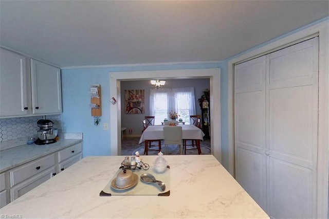 dining area featuring a notable chandelier