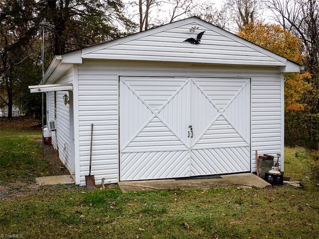 view of outbuilding featuring a lawn