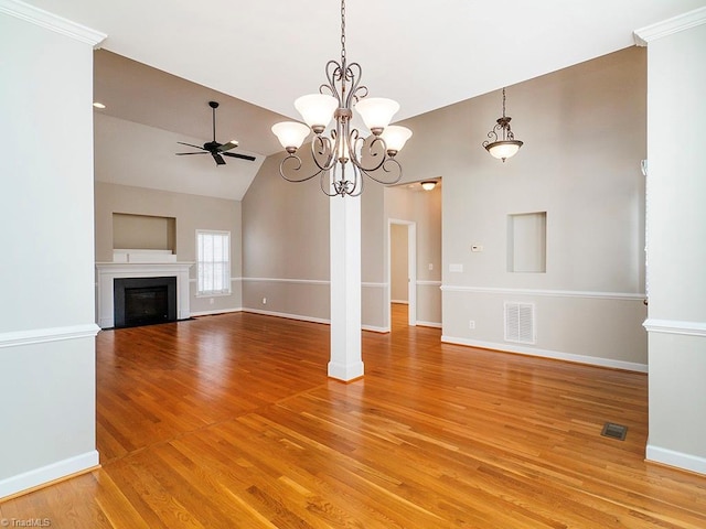 unfurnished living room with hardwood / wood-style flooring, vaulted ceiling, and ceiling fan