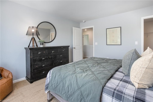 bedroom featuring carpet floors and baseboards