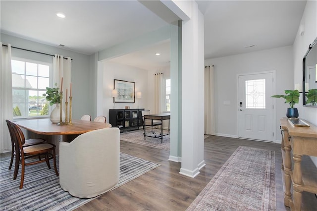 dining area featuring plenty of natural light, recessed lighting, and wood finished floors