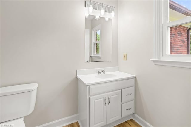121 Jacklyn Ct, High Point, NC 27265 - half bath featuring vanity, toilet, baseboards, and wood finished floors