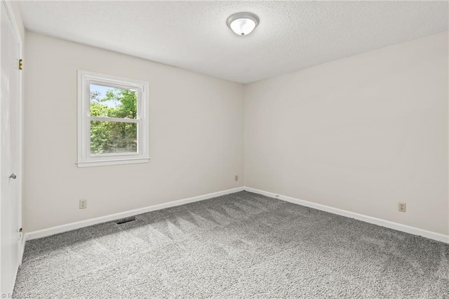 121 Jacklyn Ct, High Point, NC 27265 - empty room with carpet floors, baseboards, and a textured ceiling
