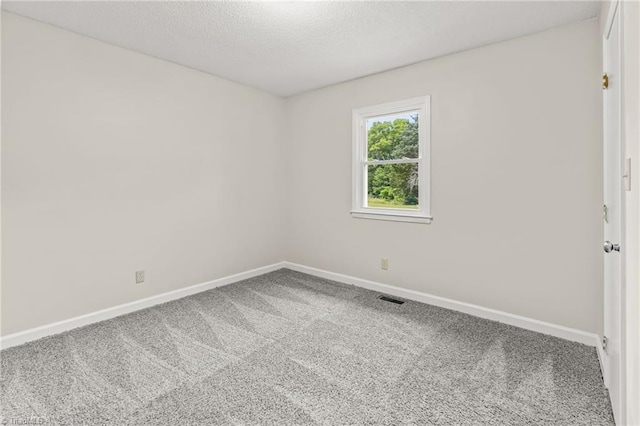 121 Jacklyn Ct, High Point, NC 27265 - carpeted spare room with baseboards and a textured ceiling