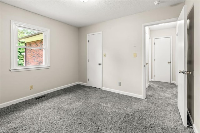 121 Jacklyn Ct, High Point, NC 27265 - unfurnished bedroom featuring carpet, baseboards, and a textured ceiling