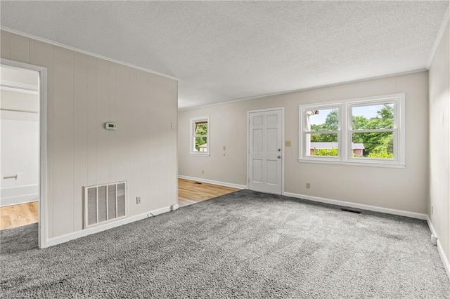 121 Jacklyn Ct, High Point, NC 27265 - carpeted empty room featuring crown molding, a textured ceiling, and baseboards
