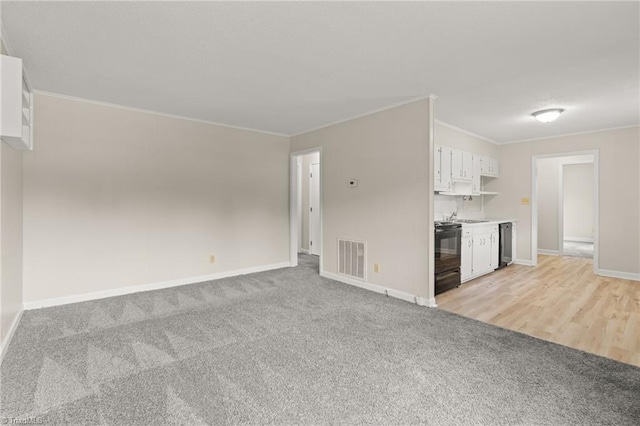 121 Jacklyn Ct, High Point, NC 27265 - unfurnished living room with baseboards, crown molding, light colored carpet, and a sink