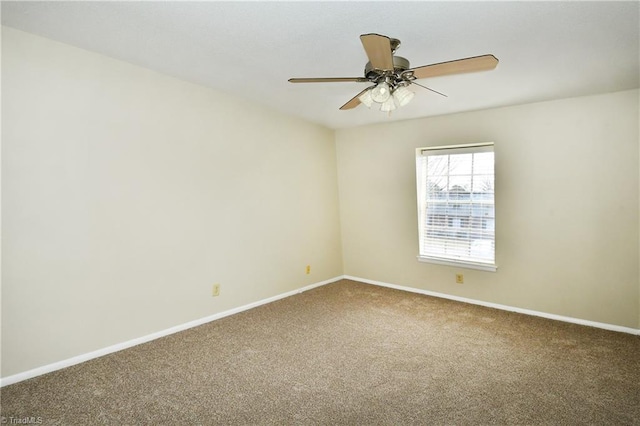 carpeted empty room with baseboards and ceiling fan