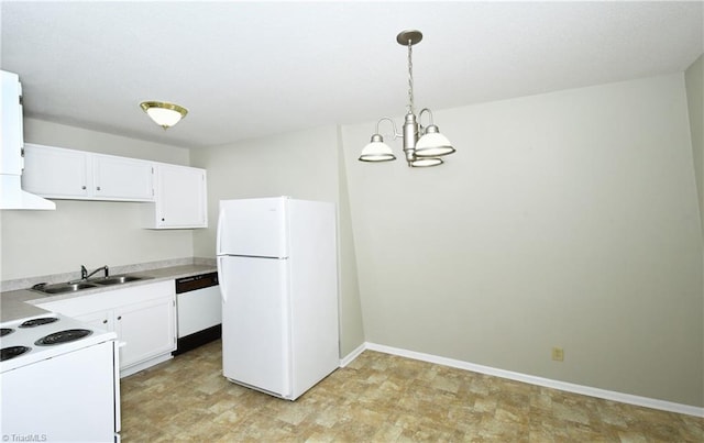 kitchen with white appliances, a sink, pendant lighting, white cabinetry, and a chandelier