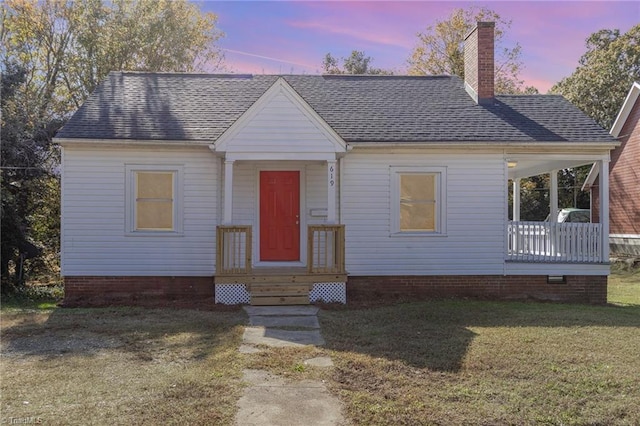 view of front of house with a yard