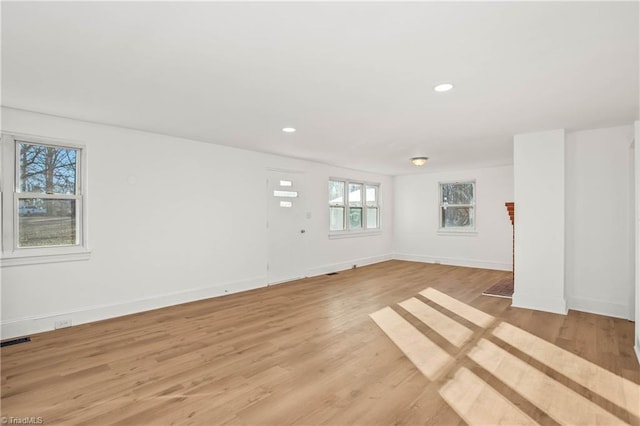 unfurnished room with light hardwood / wood-style floors