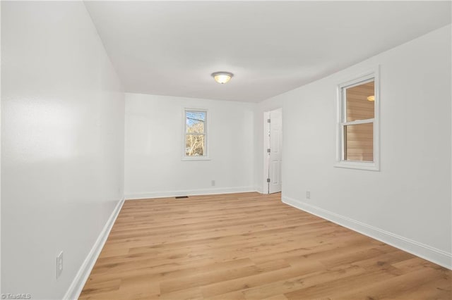 spare room with light wood-type flooring