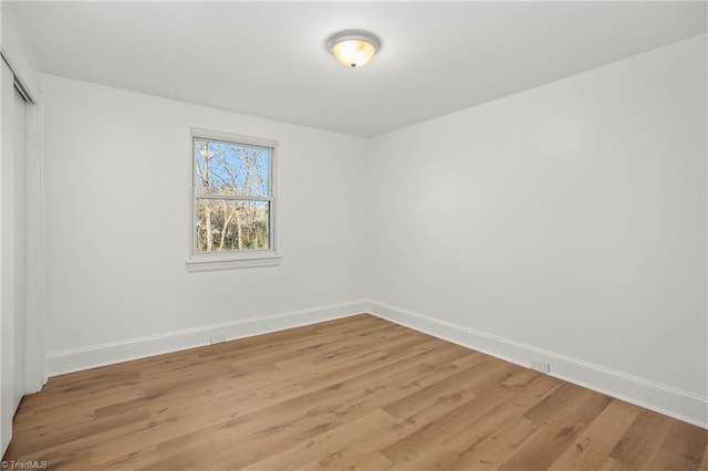 spare room featuring light hardwood / wood-style floors