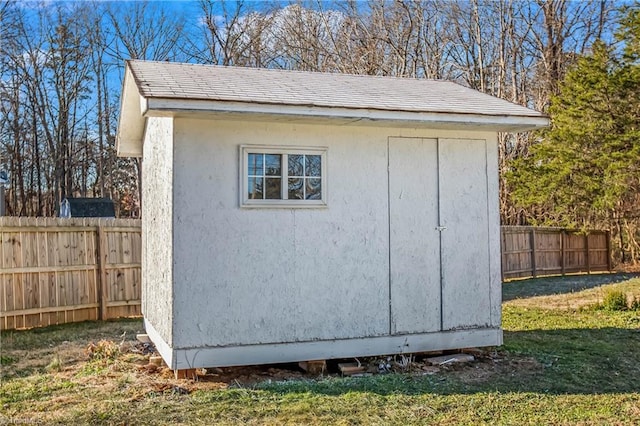 view of outbuilding featuring a lawn