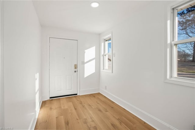 entryway with light hardwood / wood-style flooring