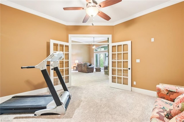 exercise area featuring french doors, ceiling fan, carpet, and ornamental molding