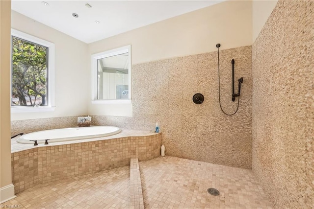 bathroom with tile patterned flooring and independent shower and bath