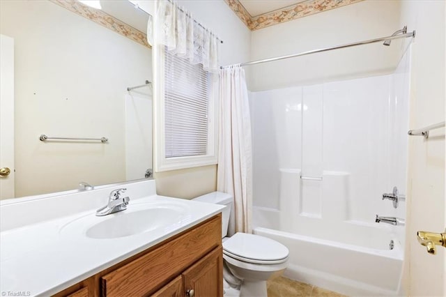 full bathroom with tile patterned floors, shower / bath combo with shower curtain, vanity, and toilet