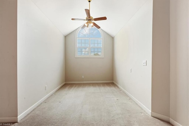 bonus room with vaulted ceiling, ceiling fan, and light colored carpet