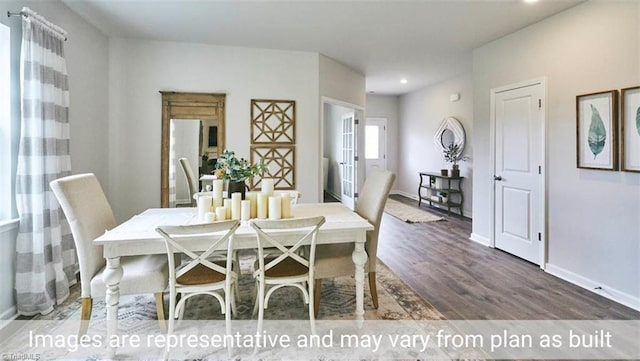 dining space with dark hardwood / wood-style flooring