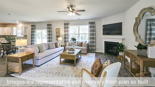 living room featuring hardwood / wood-style floors, a wealth of natural light, and ceiling fan