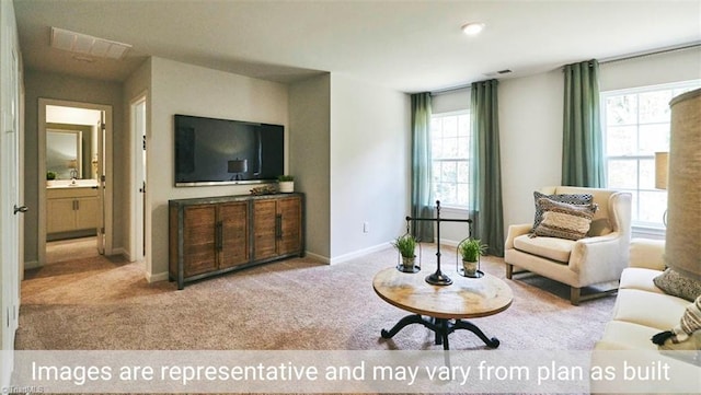 living room featuring light colored carpet