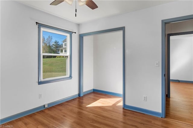 unfurnished bedroom with hardwood / wood-style floors and ceiling fan