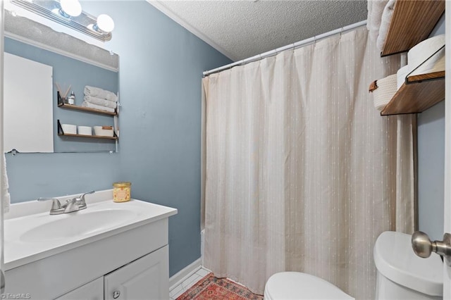 bathroom with vanity, a textured ceiling, and toilet