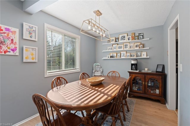 dining space featuring light wood-type flooring