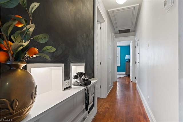 hall featuring dark hardwood / wood-style floors and ornamental molding