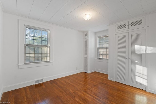 unfurnished bedroom with wood-type flooring