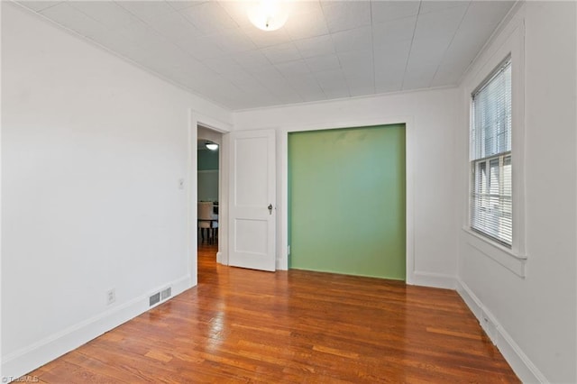 empty room featuring hardwood / wood-style floors