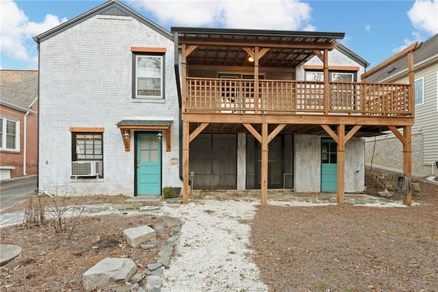 view of front of home with cooling unit and a wooden deck