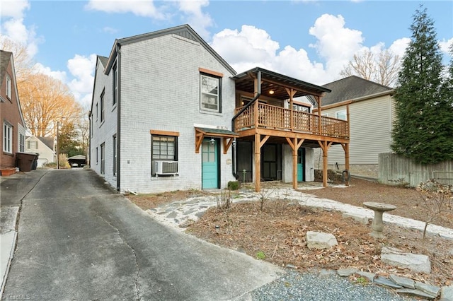 exterior space featuring cooling unit and a wooden deck