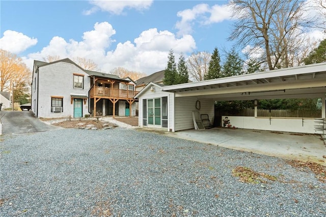 view of front facade featuring a carport and a deck