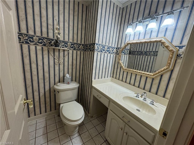 bathroom featuring vanity, toilet, and tile patterned flooring