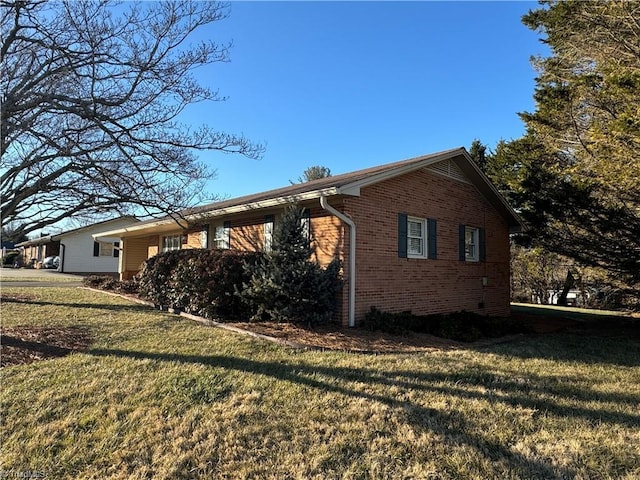 view of home's exterior featuring a yard