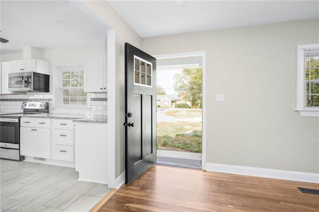 foyer with light hardwood / wood-style floors