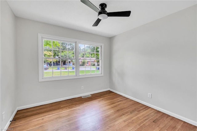 unfurnished room featuring light wood-type flooring and ceiling fan