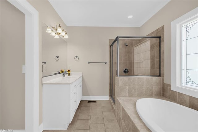 1905 Overshoot Ct, Greensboro, NC 27455 - bathroom with vanity, a garden tub, a stall shower, and tile patterned flooring