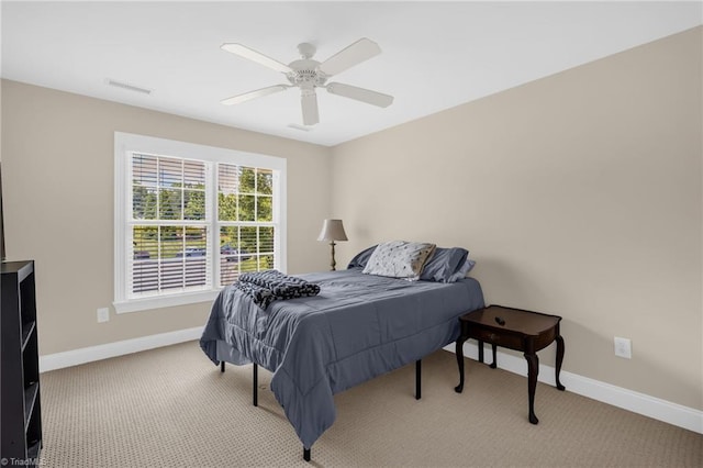 1905 Overshoot Ct, Greensboro, NC 27455 - bedroom with light colored carpet and a ceiling fan
