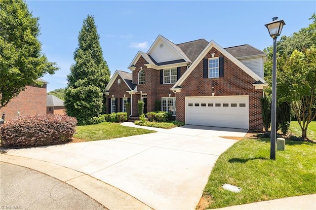 1905 Overshoot Ct, Greensboro, NC 27455 - traditional home with brick siding, concrete driveway, and a front yard