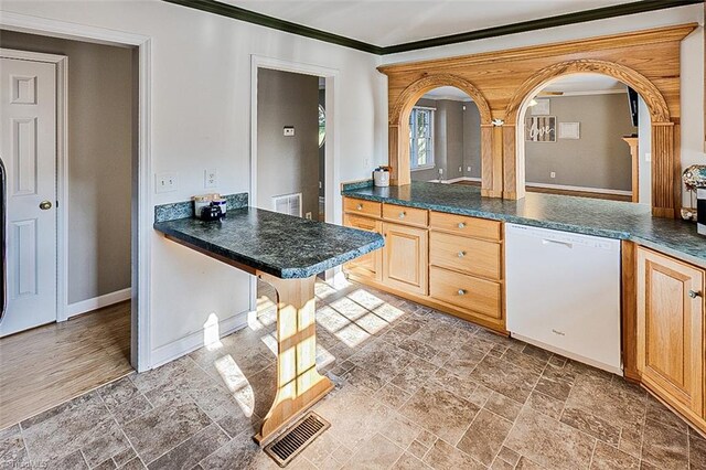 kitchen featuring crown molding, dishwasher, and light brown cabinetry