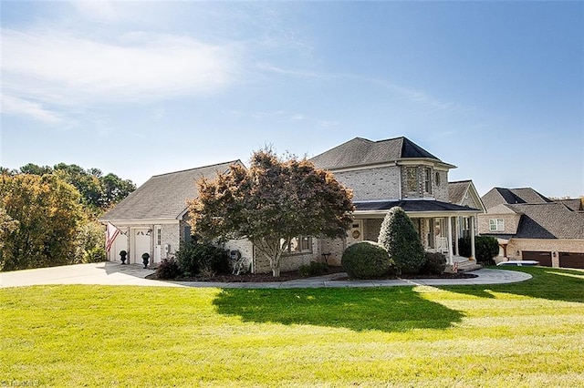 view of front facade featuring a front yard and a garage