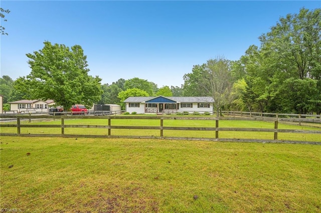 view of yard featuring a view of rural / pastoral area
