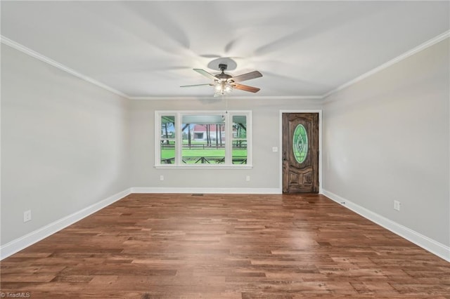 entrance foyer with ceiling fan, ornamental molding, baseboards, and wood finished floors